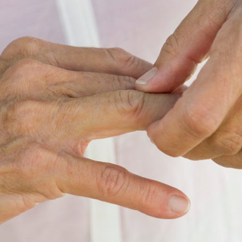 What causes finger joint pain?