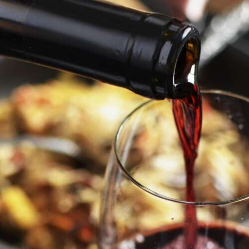 Why does even a small amount of red wine give some people headaches?